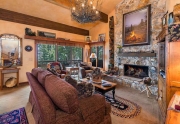 Dramatic living room with vaulted ceilings and sweeping lake views