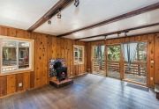 Living Area with Gas Fireplace and Original Hardwood Floors