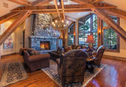 Breathtaking Great Room with Picture Windows and Floor to Ceiling Stone Fireplace | Northstar Luxury Lodge