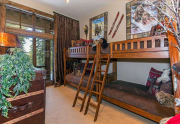 Kids Guest Bedroom featuring four bunks and a private en suite bathroom | Tahoe Luxury Home