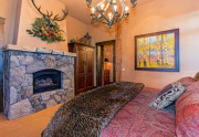 Guest Bedroom with en suite bathroom and stone fireplace | Lake Tahoe Real Estate