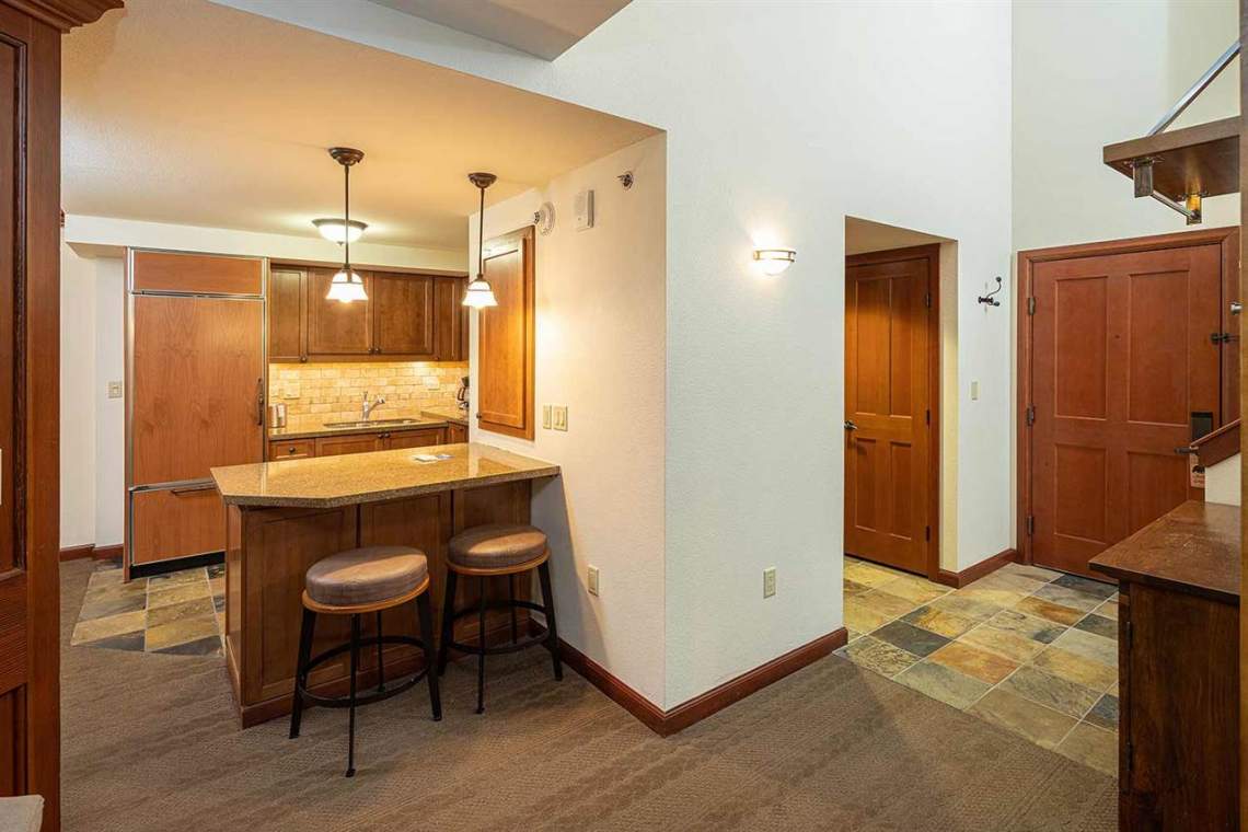 Kitchen island and entrance | 400 Squaw Creek Rd.
