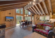 Open concept living and kitchen area with vaulted ceilings