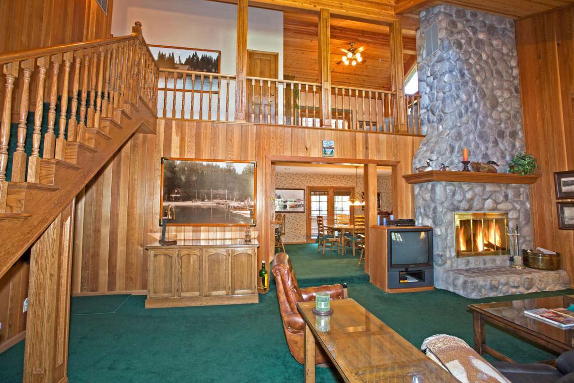 Large Living Area with floor to cieling stone fireplace