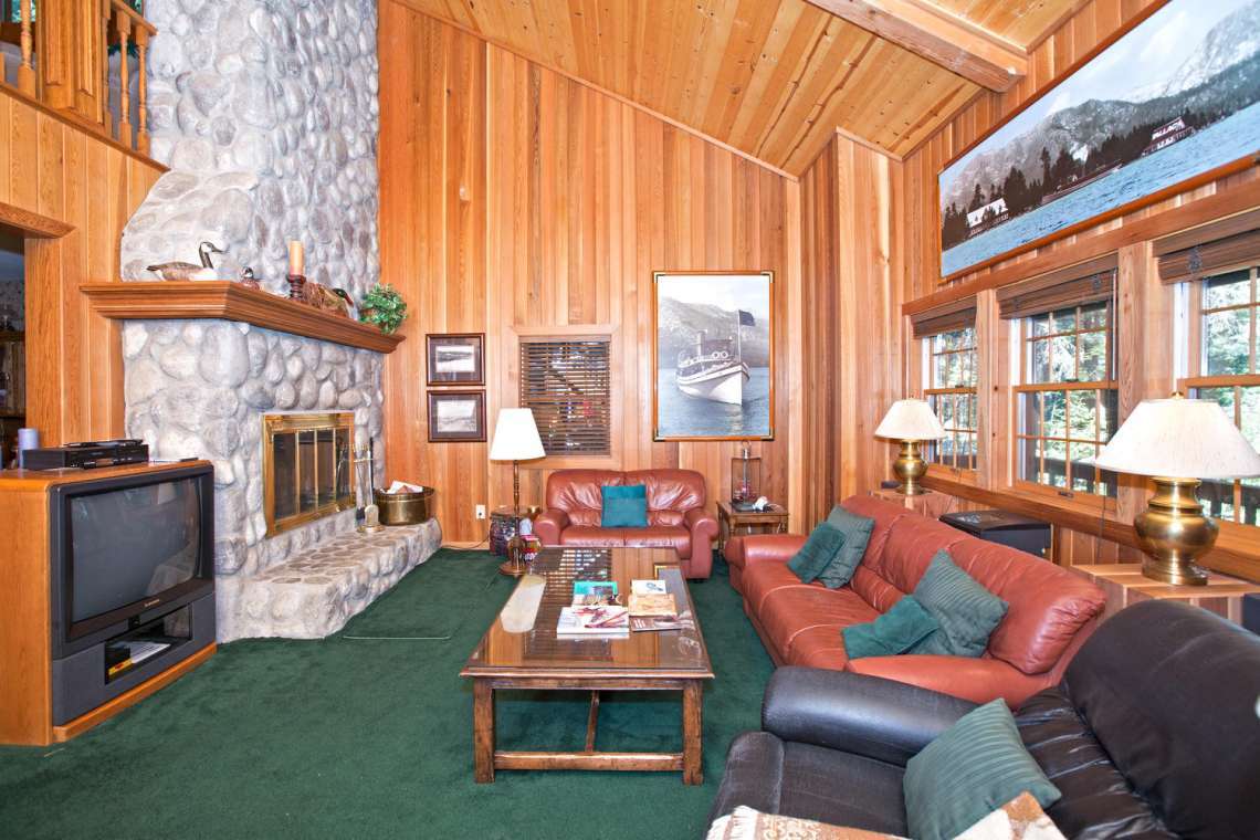 Large Living Area with floor to cieling stone fireplace