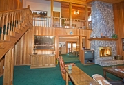 Large Living Area with floor to cieling stone fireplace