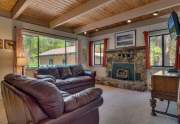 Living room wtih stone fireplace