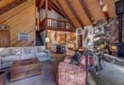 Living room with stone fireplace | Tahoe City Ski Chalet
