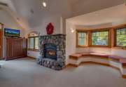 Breathtaking Master bedroom with rock fireplace