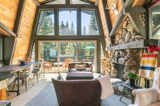 Gorgeous living room with picture windows | Alpine Meadows Home