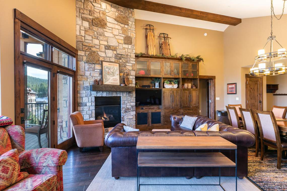 Living room with stone fireplace | Village at Northstar Condo