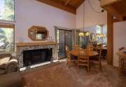 Living room with rock fireplace | Rare Northstar Townhome