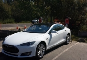 Tesla Model S Charging at Oliver Luxury Real Estate