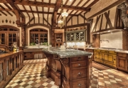 the-chefs-kitchen-has-hand-carved-wooden-beams-and-its-own-fireplace