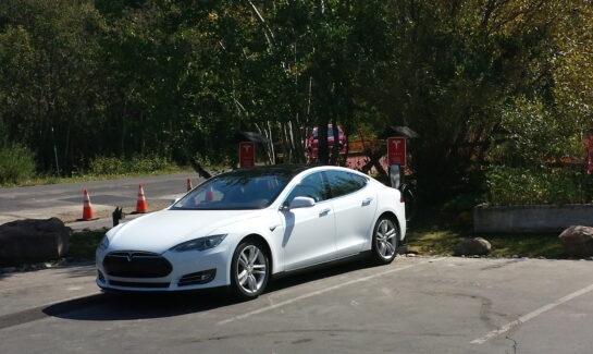 Tesla Model S Charging at Oliver Luxury Real Estate