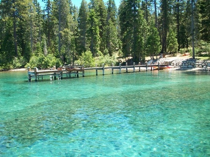 135 Quiet Walk Road | Tahoma Luxury Real Estate, image of clear lake tahoe and pier with trees in the background