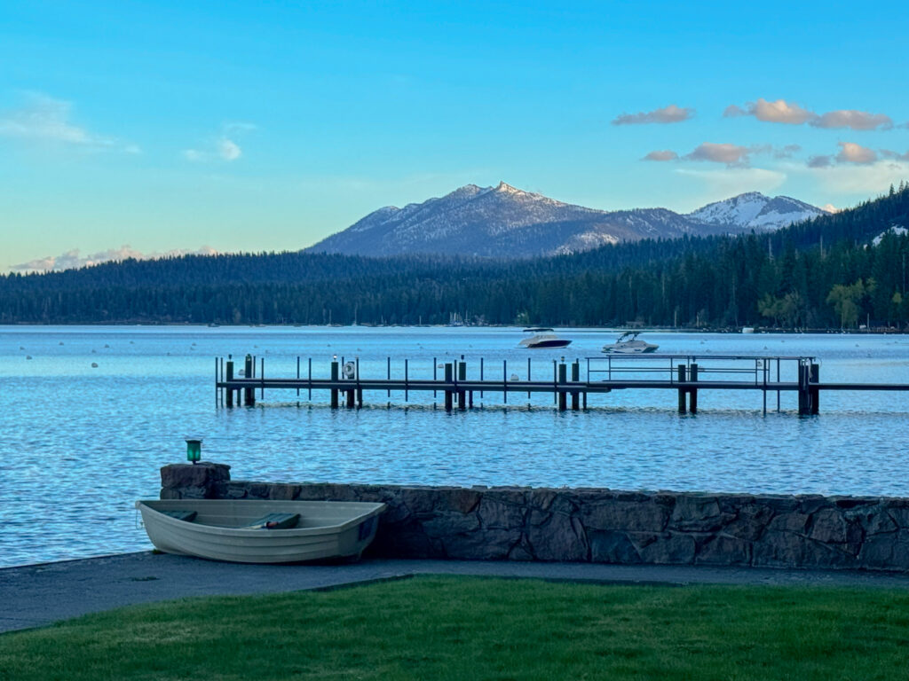Lake Tahoe Waterfront Lifestyle and Mountain Views Lake Tahoe waterfront with a private pier, boats and snow-covered Sierra Nevada mountains